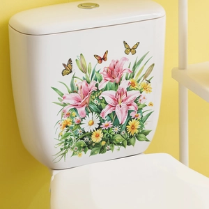 Detailed view of colorful floral and butterfly decals applied to a white toilet tank