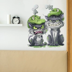 Detail of cartoon gray cats with green monster hats wall stickers on a white bedroom wall