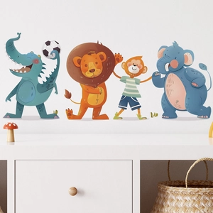 Detail view of cartoon animal wall stickers featuring a lion and elephant in a nursery room