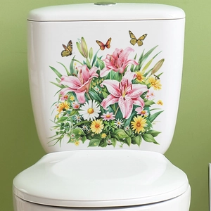 Detailed view of self-adhesive floral toilet stickers with pink lilies and yellow daisies