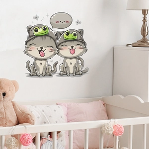 Detail of funny cartoon cats with frog hats wall stickers in a cozy nursery room setting