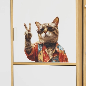 Detail of creative summer cat wall sticker with orange tabby in Hawaiian shirt on white cabinet