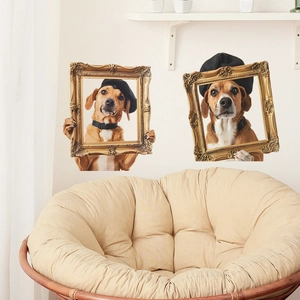 Detail of dog wall stickers in vintage gold frames on a white bedroom wall