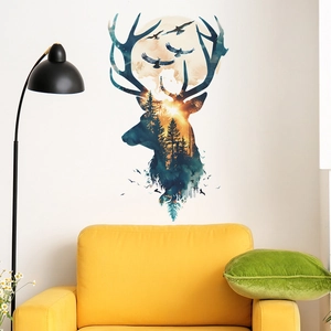 Macro shot of dream deer forest wall sticker on a white wall above a yellow sofa