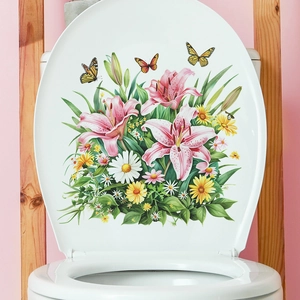 Detail of waterproof flower and butterfly wall stickers applied on a white toilet lid cover