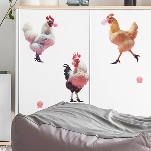 Funny rooster wall stickers blowing pink bubbles applied on a white kitchen cabinet