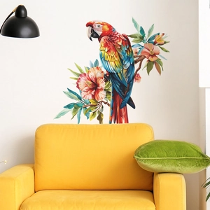 Colorful macaw parrot and hibiscus flower wall decal above a modern yellow sofa