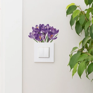 Detailed view of purple saffron flower wall stickers applied above a white light switch