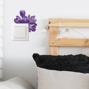 Detail of purple flower wall stickers for light switches with cozy home bedroom decor