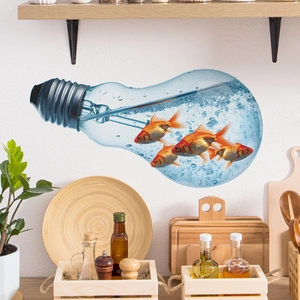 Creative light bulb fish wall decal with red goldfish and bubbles on a kitchen wall