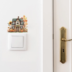Detail of sunflower cottage wall sticker applied above a light switch on a white wall