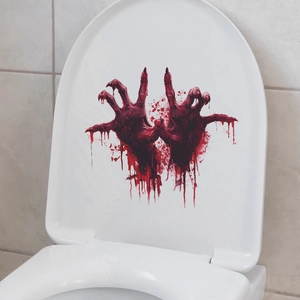 Detail of bloody handprint stickers on a white toilet lid for Halloween bathroom decor