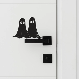 Minimalist black ghost stickers on a white door for creative Halloween home wall decor