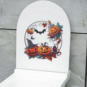 Detail of Halloween toilet lid sticker with pumpkins, bats and spiders on a white surface