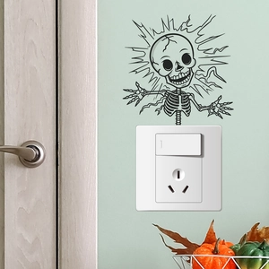 Detail showing creative electric shock skeleton wall sticker above a white light switch