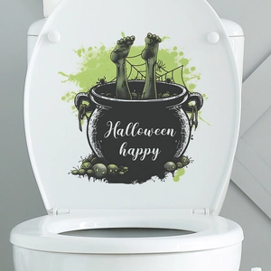Detail of Halloween witch cauldron toilet sticker with green slime and spider web design