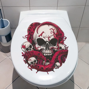 Detail of octopus tentacles and skull sticker applied to a white bathroom toilet lid