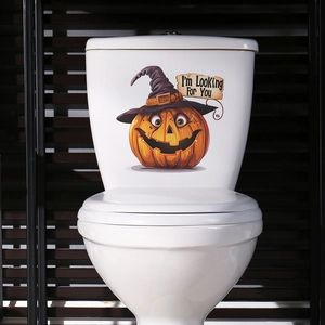 Close-up of Halloween toilet sticker featuring a cartoon pumpkin with a witch hat and sign