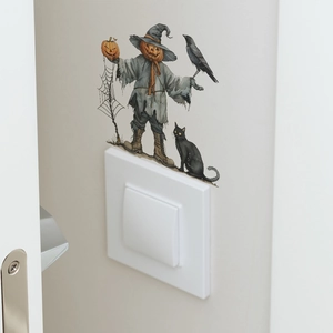 Détail d'un sticker mural citrouille d'Halloween au-dessus d'un interrupteur