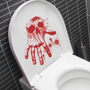 Spooky Halloween toilet lid sticker featuring red bloody handprints and a skull design