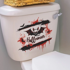 Detail of Halloween blood splatters and bat stickers on a white toilet lid decoration