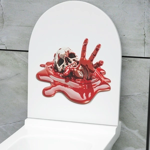 Detailed 3D bloody skull and hand sticker applied on a white toilet lid for Halloween decor