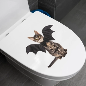Funny Halloween cat with bat wings wall decal applied on white bathroom toilet lid