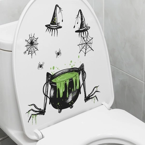 Halloween witch potion cauldron and spider stickers on a white bathroom toilet lid