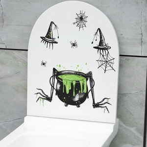 Halloween toilet seat decal featuring a green potion cauldron with spiders and witch hat