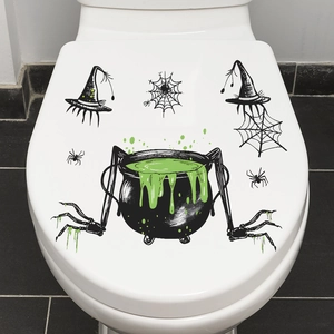 Halloween toilet lid sticker featuring a witch cauldron with green potion and spiders