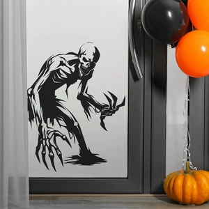 Halloween scary werewolf wall decal on window with pumpkins and festive balloons