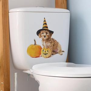 Detail of Halloween toilet sticker featuring a cute dog in a wizard hat and pumpkins