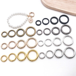 Detail of round spring O-rings in six colors and four sizes for bag accessories