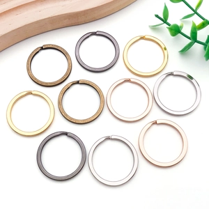 Close-up of assorted metal split rings for DIY keychains in various colorful finishes