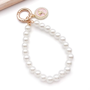 Close-up of pearl charm with golden spring ring and pink rose relief pendant