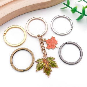 Maple leaf keychain set with enamel pendants and metal split rings in assorted finishes