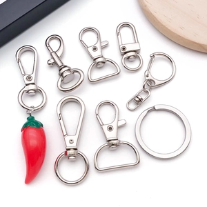 Polished silver metal lobster clasps and keyrings with a red chili pepper pendant set