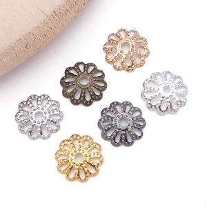 Detailed view of hollow petal bead caps in six different metal finishes for DIY jewelry