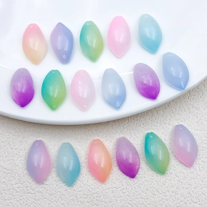 Detailed view of colorful gradient lotus petal beads for DIY jewelry making and hair pins