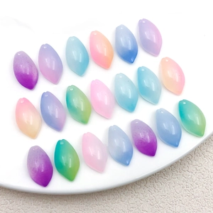 Detailed macro view of colorful gradient leaf-shaped resin beads for DIY jewelry making