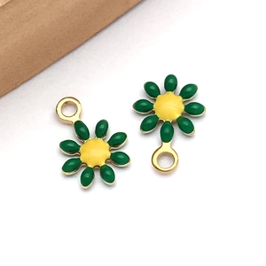 Detail of yellow and green daisy flower charms with gold hanging rings for DIY jewelry
