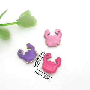 Detailed size view of colorful enamel crab charms for DIY jewelry making 1cm