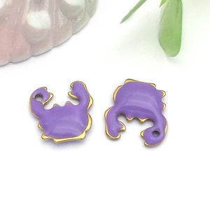 Detailed view of purple enamel crab charms with gold plating for DIY jewelry making