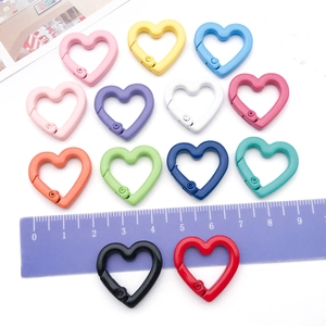 Close-up of 12-color heart alloy spring clasps for DIY jewelry and bag accessories