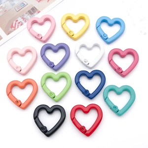 Detail of multi-colored heart-shaped alloy spring hooks for DIY jewelry and bag accessories