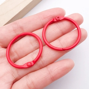 Macro shot of 30mm red painted metal binder rings for DIY crafts and keychains