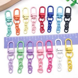 Close-up of 15 colorful zinc alloy lobster clasps with chains for DIY keychains