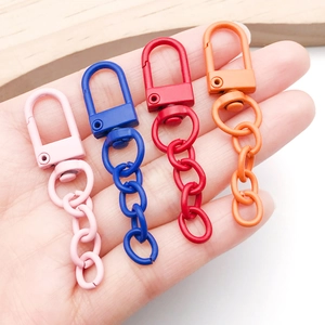 Detail of colorful matte zinc alloy U-shaped lobster clasps with chains for keychains