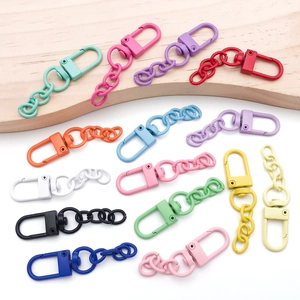 Macro view of colorful matte lacquer metal lobster clasps and chain link accessories