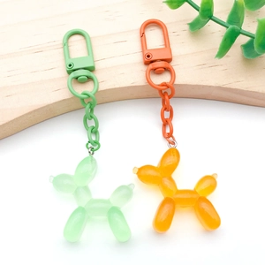 Colorful resin balloon dog keychains with matching metal chain and carabiner hooks